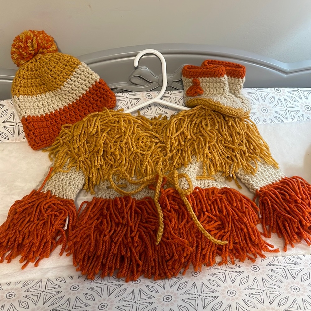 Handmade set including sweater, hat, and booties